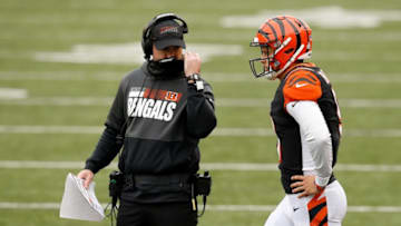 Cincinnati Bengals head coach Zac Taylor and quarterback Joe Burrow (9) discuss a play during a timeout in the fourth quarter of the NFL Week 7 game between the Cincinnati Bengals and the Cleveland Browns at Paul Brown Stadium in downtown Cincinnati on Sunday, Oct. 25, 2020. The Bengals and Browns exchanged late touchdowns, finishing in a 37-34 win for the Browns.Cleveland Browns At Cincinnati Bengals