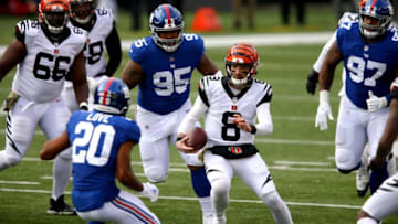 Cincinnati Bengals quarterback Brandon Allen (8) carries the ball as New York Giants free safety Julian Love (20) defends in the second quarter during an NFL Week 12 football game, Sunday, Nov. 29, 2020, at Paul Brown Stadium in Cincinnati.New York Giants At Cincinnati Bengals Nov 29