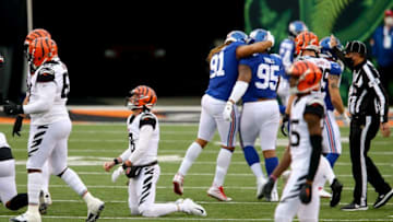 Cincinnati Bengals quarterback Brandon Allen (8), left, reacts after fumbling as the New York Giants defense celebrates in the fourth quarter during an NFL Week 12 football game, Sunday, Nov. 29, 2020, at Paul Brown Stadium in Cincinnati. The New York Giants won 19-17.New York Giants At Cincinnati Bengals Nov 29