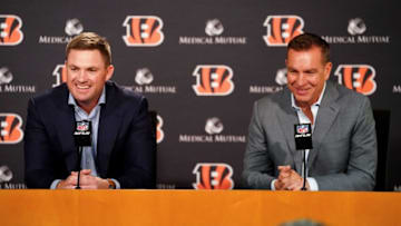 Cincinnati Bengals head coach Zac Taylor, left, and defensive coordinator Lou Anarumo, right, address the media after the team selected safety Daxton Hill with their first-round pick in the 2022 NFL Draft, Thursday, April 28, 2022, at Paul Brown Stadium in Cincinnati.Nfl Draft April 28 0029