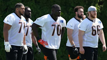 From left: Offensive tackle La'el Collins (71), offensive guard Hakeem Adeniji, offensive tackle D'Ante Smith, offensive tackle Devin Cochran (77) and offensive guard Alex Cappa (66) walk to the next drill during practice, Tuesday, May 17, 2022, at the Paul Brown Stadium practice fields in Cincinnati.Cincinnati Bengals Practice May 17 0102