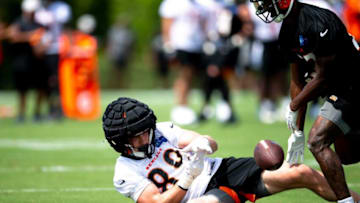 Cincinnati Bengals tight end Drew Sample (89) drops a pass as Cincinnati Bengals safety Dax Hill (23) covers him during Cincinnati Bengals preseason training camp at the Paul Brown Stadium training facility in Cincinnati on Thursday, July 28, 2022.Cincinnati Bengals Training Camp 177