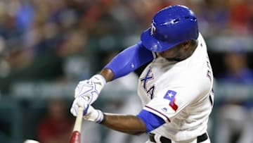Jun 24, 2016; Arlington, TX, USA; Texas Rangers first baseman Jurickson Profar (19) connects for a single against the Boston Red Sox during a baseball game at Globe Life Park in Arlington. Mandatory Credit: Jim Cowsert-USA TODAY Sports