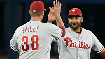 Jun 13, 2016; Toronto, Ontario, CAN; Philadelphia Phillies third baseman Andres Blanco (4) high fives with relief pitcher Andrew Bailey (38) as they celebrate a 7-0 win over Toronto Blue Jays at Rogers Centre. Mandatory Credit: Dan Hamilton-USA TODAY Sports