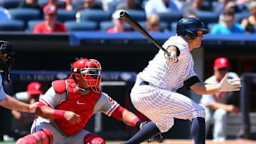 Jun 24, 2015; Bronx, NY, USA; New York Yankees center fielder Brett Gardner (11) hits a RBI single against the Philadelphia Phillies in the fourth inning at Yankee Stadium. Mandatory Credit: Andy Marlin-USA TODAY Sports