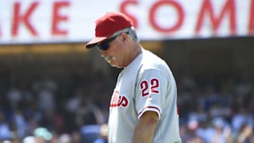 Aug 10, 2016; Los Angeles, CA, USA; Philadelphia Phillies pitching coach Bob McClure (22) goes out to talk to his pitcher in the seventh inning against the Los Angeles Dodgers at Dodger Stadium. Mandatory Credit: Richard Mackson-USA TODAY Sports