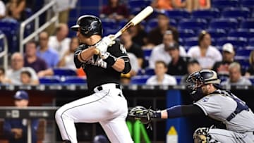 Aug 27, 2016; Miami, FL, USA; Miami Marlins third baseman Martin Prado (14) connects for a base hit during the first inning against the San Diego Padres at Marlins Park. Mandatory Credit: Steve Mitchell-USA TODAY Sports