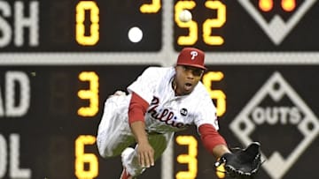 Jun 2, 2015; Philadelphia, PA, USA; Philadelphia Phillies right fielder Ben Revere (2) dives for ball hit by Cincinnati Reds second baseman Brandon Phillips (4) (not pictured) during the third inning at Citizens Bank Park. Mandatory Credit: Eric Hartline-USA TODAY Sports