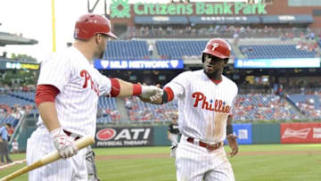 Jul 18, 2016; Philadelphia, PA, USA; Philadelphia Phillies center fielder Odubel Herrera (37) celebrates with catcher Cameron Rupp (29) after scoring a run during the first inning against the Miami Marlins at Citizens Bank Park. Mandatory Credit: Eric Hartline-USA TODAY Sports