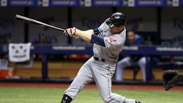 Jul 1, 2015; St. Petersburg, FL, USA; Cleveland Indians right fielder Brandon Moss (44) hits a 2-RBI double during the second inning against the Tampa Bay Rays at Tropicana Field. Mandatory Credit: Kim Klement-USA TODAY Sports