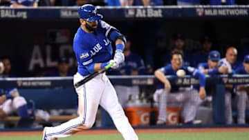 Oct 19, 2016; Toronto, Ontario, CAN; Toronto Blue Jays right fielder Jose Bautista (19) hits a double during the ninth inning against the Cleveland Indians in game five of the 2016 ALCS playoff baseball series at Rogers Centre. Mandatory Credit: Nick Turchiaro-USA TODAY Sports