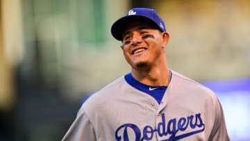DENVER, CO - SEPTEMBER 8: Manny Machado #8 of the Los Angeles Dodgers smiles as he runs off the field in the middle of the second inning of a game against the Colorado Rockies at Coors Field on September 8, 2018 in Denver, Colorado. (Photo by Dustin Bradford/Getty Images)