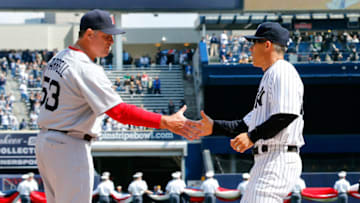 NEW YORK, NY - APRIL 01: (NEW YORK DAILIES OUT) Managers John Farrell #53 of the Boston Red Sox and Joe Girardi #28 of the New York Yankees shake hands during Opening Day ceremonies at Yankee Stadium on April 1, 2013 in the Bronx borough of New York City. The Red Sox defeated the Yankees 8-2. (Photo by Jim McIsaac/Getty Images)