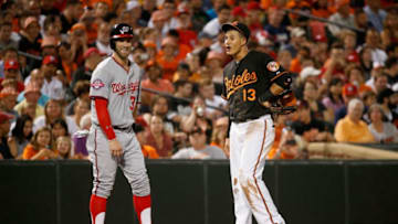 BALTIMORE, MD - JULY 10: Bryce Harper #34 of the Washington Nationals and Manny Machado #13 of the Baltimore Orioles talk during their game at Oriole Park at Camden Yards on July 10, 2015 in Baltimore, Maryland. (Photo by Rob Carr/Getty Images)