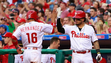 PHILADELPHIA, PA - MAY 20: Cesar Hernandez #16 of the Philadelphia Phillies is congratulated by teammate Freddy Galvis #13 after scoring on a ball hit by Ryan Howard #6 against the Atlanta Braves during the first inning of a game at Citizens Bank Park on May 20, 2016 in Philadelphia, Pennsylvania. (Photo by Rich Schultz/Getty Images)