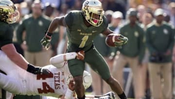 Dec 5, 2015; Waco, TX, USA; Texas Longhorns linebacker Breckyn Hager (44) tackles Baylor Bears wide receiver Corey Coleman (1) during the second half at McLane Stadium. The Longhorns defeat the Bears 23-17. Mandatory Credit: Jerome Miron-USA TODAY Sports
