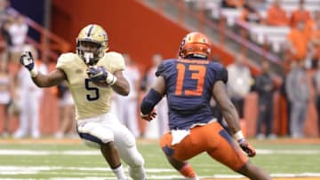 Oct 24, 2015; Syracuse, NY, USA; Pittsburgh Panthers running back Chris James (5) makes a cut to get past Syracuse Orange defensive end Ron Thompson (13) during the first quarter of a game at the Carrier Dome. Pittsburgh won 23-20. Mandatory Credit: Mark Konezny-USA TODAY Sports