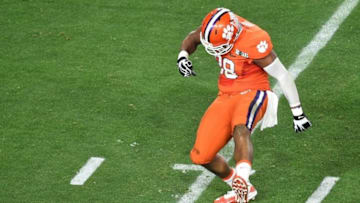 Jan 11, 2016; Glendale, AZ, USA; Clemson Tigers defensive end Kevin Dodd (98) celebrates a quarterback tackle during the second quarter against the Alabama Crimson Tide in the 2016 CFP National Championship at University of Phoenix Stadium. Mandatory Credit: Gary A. Vasquez-USA TODAY Sports