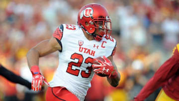 October 24, 2015; Los Angeles, CA, USA; Utah Utes running back Devontae Booker (23) runs the ball against the Southern California Trojans during the first half at Los Angeles Memorial Coliseum. Mandatory Credit: Gary A. Vasquez-USA TODAY Sports