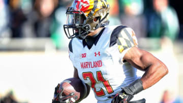 Nov 14, 2015; East Lansing, MI, USA; Maryland Terrapins defensive back Sean Davis (21) runs with the ball after intercepting Michigan State Spartans quarterback Tyler O'Connor (not pictured) during the 2nd half of a game at Spartan Stadium. Mandatory Credit: Mike Carter-USA TODAY Sports
