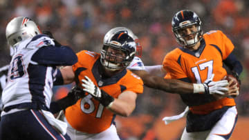 DENVER, CO - NOVEMBER 29: Quarterback Brock Osweiler #17 of the Denver Broncos scrambles while center Matt Paradis #61 of the Denver Broncos blocks against defensive tackle Dominique Easley #99 of the New England Patriots in the first quarter at Sports Authority Field at Mile High on November 29, 2015 in Denver, Colorado. (Photo by Dustin Bradford/Getty Images)