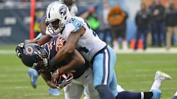 CHICAGO, IL - NOVEMBER 27: Josh Bellamy #11 of the Chicago Bears is dropped by Avery Williamson #54 of the Tennessee Titans after making a catch
at Soldier Field on November 27, 2016 in Chicago, Illinois. The Titans defeated the Bears 27-21. (Photo by Jonathan Daniel/Getty Images)