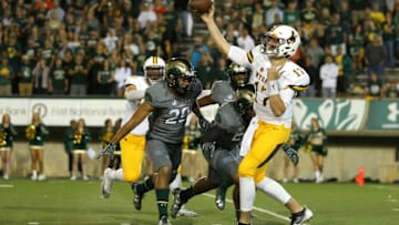 FORT COLLINS, CO - OCTOBER 1: Quarterback Josh Allen #17 of the Wyoming Cowboys throws a pass under pressure from the Colorado State Rams defense during the first quarter at Sonny Lubick Field at Hughes Stadium on October 1, 2016 in Fort Collins, Colorado. (Photo by Justin Edmonds/Getty Images)