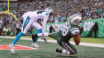 EAST RUTHERFORD, NJ - NOVEMBER 26: Tight end Austin Seferian-Jenkins #88 of the New York Jets attempts to make a catch against cornerback James Bradberry #24 of the Carolina Panthers during the fourth quarter of the game at MetLife Stadium on November 26, 2017 in East Rutherford, New Jersey. The play was originally called a touchdown, but was reviewed, ruled as an incomplete pass and reversed. (Photo by Abbie Parr/Getty Images)