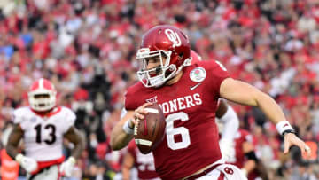PASADENA, CA - JANUARY 01: Baker Mayfield #6 of the Oklahoma Sooners rushes out of the pocket during the third quarter in the 2018 College Football Playoff Semifinal Game against the Georgia Bulldogs at the Rose Bowl Game presented by Northwestern Mutual at the Rose Bowl on January 1, 2018 in Pasadena, California. (Photo by Harry How/Getty Images)