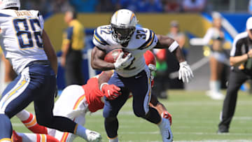 CARSON, CA - SEPTEMBER 24: Justin Houston #50 of the Kansas City Chiefs attempts to tackle Branden Oliver #32 of the Los Angeles Chargers during the NFL game at the StubHub Center on September 24, 2017 in Carson, California. (Photo by Sean M. Haffey/Getty Images)