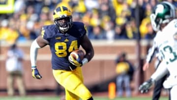 Oct 17, 2015; Ann Arbor, MI, USA; Michigan Wolverines tight end A.J. Williams (84) runs for yards after the catch against the Michigan State Spartans during the 1st quarter of a game at Michigan Stadium. Mandatory Credit: Mike Carter-USA TODAY Sports