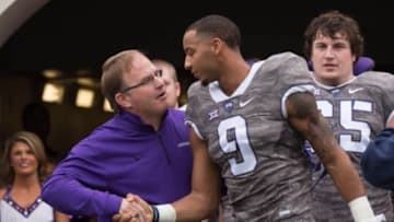 Nov 14, 2015; Fort Worth, TX, USA; TCU Horned Frogs head coach Gary Patterson talks with TCU Horned Frogs wide receiver Josh Doctson (9) before the game against the Kansas Jayhawks at Amon G. Carter Stadium. The Horned Frogs defeats the Jayhawks 23-17. Mandatory Credit: Jerome Miron-USA TODAY Sports