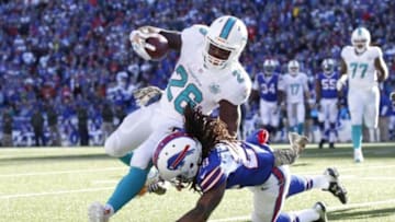 Nov 8, 2015; Orchard Park, NY, USA; Buffalo Bills cornerback Ronald Darby (28) tackles Miami Dolphins running back Lamar Miller (26) short of the end zone during the first half at Ralph Wilson Stadium. Mandatory Credit: Kevin Hoffman-USA TODAY Sports