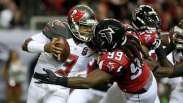 Nov 1, 2015; Atlanta, GA, USA; Tampa Bay Buccaneers quarterback Jameis Winston (3) is hit by Atlanta Falcons defensive end Adrian Clayborn (99) but prevents the tackle from Clayborn in the first quarter of their game at the Georgia Dome. Mandatory Credit: Jason Getz-USA TODAY Sports