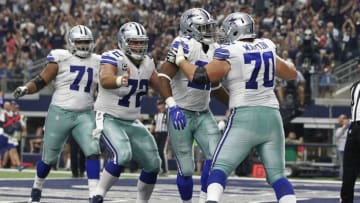 Sep 11, 2016; Arlington, TX, USA; Dallas Cowboys guard Zack Martin (70) and center Travis Frederick (72) celebrate with running back Ezekiel Elliott (21) after he scored a touchdown in the third quarter at AT&T Stadium. Mandatory Credit: Tim Heitman-USA TODAY Sports