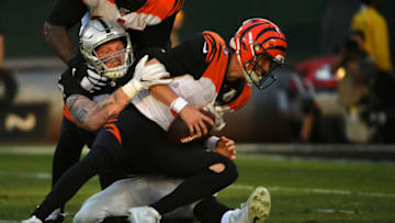 OAKLAND, CALIFORNIA - NOVEMBER 17: Maxx Crosby #98 of the Oakland Raiders sacks Ryan Finley #5 of the Cincinnati Bengals during their NFL game at RingCentral Coliseum on November 17, 2019 in Oakland, California. (Photo by Robert Reiners/Getty Images)
