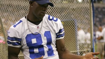 IRVING, TX - AUGUST 28: Wide receiver Terrell Owens of the Dallas Cowboys plays a little air guitar on the sidelines against the Minnesota Vikings during of a preseason game on August 28, 2008 at Texas Stadium in Irving, Texas. The Cowboys won 16-10. (Photo by Brian Bahr/Getty Images)