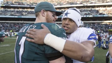 PHILADELPHIA, PA - JANUARY 1: Carson Wentz #11 of the Philadelphia Eagles hugs Dak Prescott #4 of the Dallas Cowboys after the game at Lincoln Financial Field on January 1, 2017 in Philadelphia, Pennsylvania. The Eagles defeated the Cowboys 27-13. (Photo by Mitchell Leff/Getty Images)