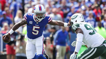 ORCHARD PARK, NY - SEPTEMBER 10: Tyrod Taylor #5 of the Buffalo Bills runs the ball as Kony Ealy #94 of the New York Jets attempts to tackle him during the first quarter on September 10, 2017 at New Era Field in Orchard Park, New York. (Photo by Brett Carlsen/Getty Images)