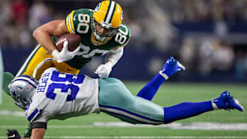 ARLINGTON, TX - OCTOBER 6: Jimmy Graham #80 of the Green Bay Packers is tackled by Jeff Heath #38 of the Dallas Cowboys after catching a pass at AT&T Stadium on October 6, 2019 in Arlington, Texas. The Packers defeated the Cowboys 34-24. (Photo by Wesley Hitt/Getty Images)