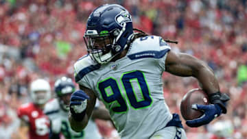 GLENDALE, ARIZONA - SEPTEMBER 29: Outside linebacker Jadeveon Clowney #90 of the Seattle Seahawks run in an interception for a touchdown in the first half of the NFL game against the Arizona Cardinals at State Farm Stadium on September 29, 2019 in Glendale, Arizona. (Photo by Jennifer Stewart/Getty Images)