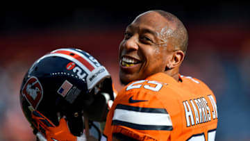 DENVER, CO - DECEMBER 22: Chris Harris #25 of the Denver Broncos smiles as players warm up before a game against the Detroit Lions at Empower Field at Mile High on December 22, 2019 in Denver, Colorado. (Photo by Dustin Bradford/Getty Images)