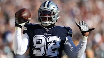 LANDOVER, MARYLAND - DECEMBER 12: Dorance Armstrong #92 of the Dallas Cowboys celebrates after returning a fumble for a touchdown during the first quarter against the Washington Football Team at FedExField on December 12, 2021 in Landover, Maryland. (Photo by Rob Carr/Getty Images)