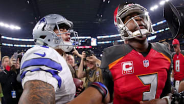 ARLINGTON, TX - DECEMBER 18: Dak Prescott #4 of the Dallas Cowboys greets Jameis Winston #3 of the Tampa Bay Buccaneers at midfield after the Dallas Cowboys beat the Tampa Bay Buccaneers 26-20 at AT&T Stadium on December 18, 2016 in Arlington, Texas. (Photo by Tom Pennington/Getty Images)