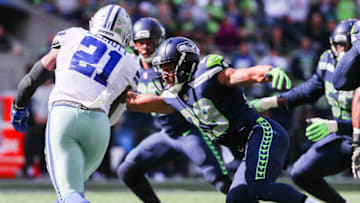 SEATTLE, WA - SEPTEMBER 23: Safety Earl Thomas #29 of the Seattle Seahawks tackles running back Ezekiel Elliott #21 of the Dallas Cowboys in the first half at CenturyLink Field on September 23, 2018 in Seattle, Washington. (Photo by Abbie Parr/Getty Images)