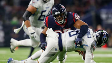 HOUSTON, TX - NOVEMBER 26: Christian Covington #95 of the Houston Texans sacks Marcus Mariota #8 of the Tennessee Titans in the second quarter at NRG Stadium on November 26, 2018 in Houston, Texas. (Photo by Tim Warner/Getty Images)