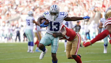 SANTA CLARA, CA - AUGUST 10: Michael Gallup #13 of the Dallas Cowboys gets tackled from behind by Dre Greenlaw #57 of the San Francisco 49ers during the first quarter of a preseason NFL football game at Levi's Stadium on August 10, 2019 in Santa Clara, California. (Photo by Thearon W. Henderson/Getty Images)