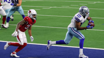 ARLINGTON, TEXAS - OCTOBER 19: Amari Cooper #19 of the Dallas Cowboys catches a touchdown pass against Kevin Peterson #27 of the Arizona Cardinals during the fourth quarter at AT&T Stadium on October 19, 2020, in Arlington, Texas. (Photo by Ronald Martinez/Getty Images)