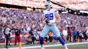 FOXBOROUGH, MASSACHUSETTS - OCTOBER 17: Blake Jarwin #89 of the Dallas Cowboys scores a touchdown against the New England Patriots in the first quarter at Gillette Stadium on October 17, 2021 in Foxborough, Massachusetts. (Photo by Maddie Meyer/Getty Images)