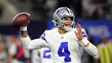 ARLINGTON, TEXAS - NOVEMBER 25: Dak Prescott #4 of the Dallas Cowboys scrambles in the pocket as he looks for an open receiver against the Las Vegas Raiders at AT&T Stadium on November 25, 2021 in Arlington, Texas. (Photo by Richard Rodriguez/Getty Images)